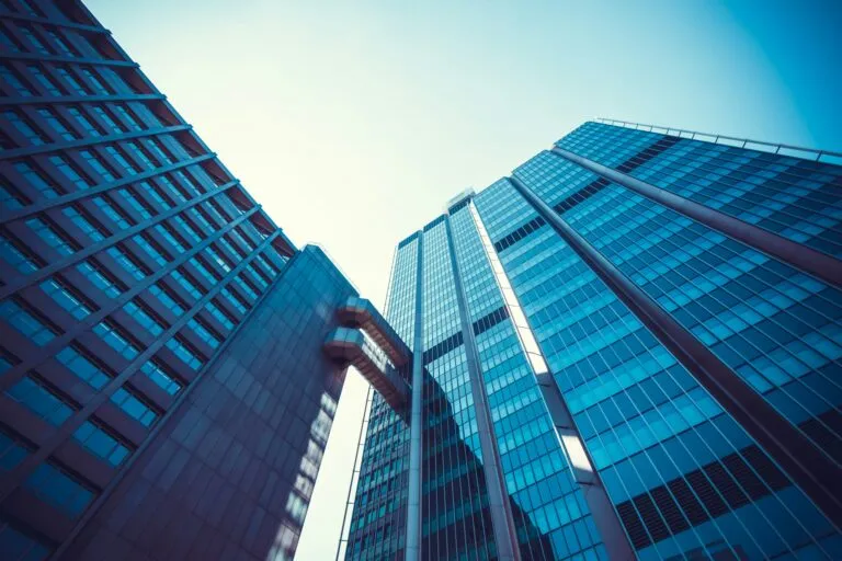 Modern office buildings with sleek glass facades and architectural design, representing commercial spaces in Dallas, supporting HVAC efficiency and indoor comfort.