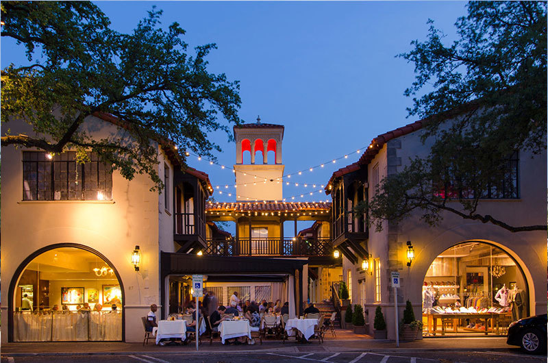 Elegant dining in Park Cities, Dallas, TX at twilight.  String lights illuminate the outdoor patio, showcasing a charming, upscale atmosphere.