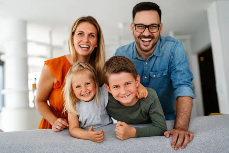 Family relaxing comfortably at home after an HVAC repair